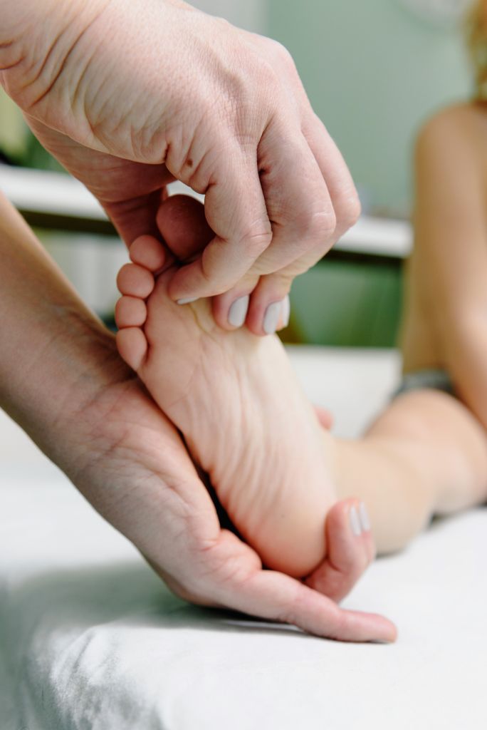 A relaxing foot massage therapy session focusing on wellness and relaxation.